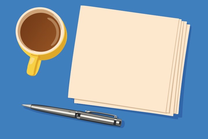 Blank notepad with a pen and a cup of coffee on a blue desk.