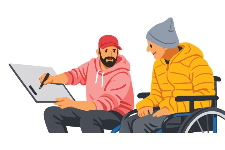 Male coworkers in a design studio discussing artwork on a tablet.