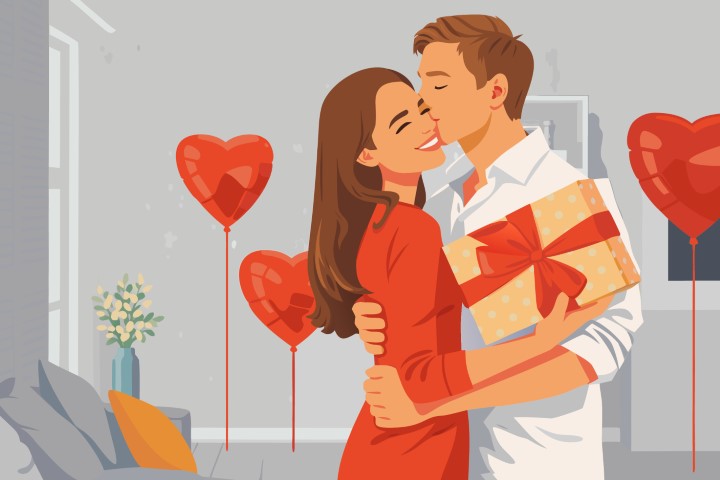 Couple standing near a window and sharing a romantic kiss.