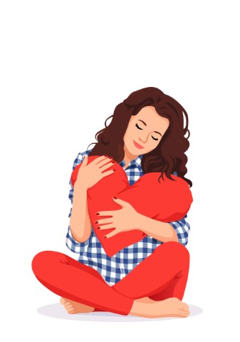 Gentle woman sitting on the floor and embracing a large plush heart tenderly.