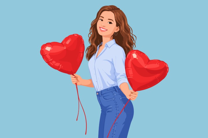 Woman in casual attire walking and holding two heart balloons.