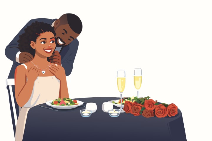 A romantic couple enjoys an intimate candlelit dinner at a beautifully set table.