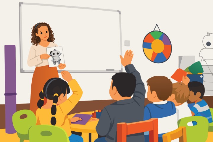 Teacher showing flashcards to a classroom of engaged students.