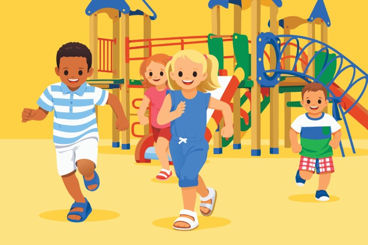 Happy children running and playing together on a colorful outdoor playground.