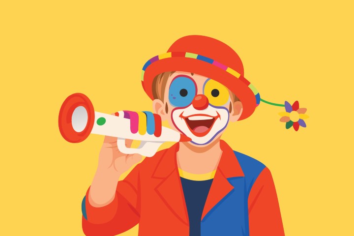 Happy clown in colorful costume playing a trumpet while cheering for a celebration.