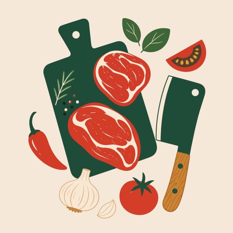 Raw meat cuts on a kitchen cutting board with cooking ingredients.