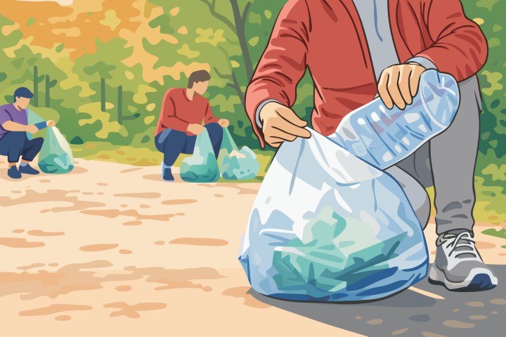 Volunteers collecting garbage in a park to protect the environment.