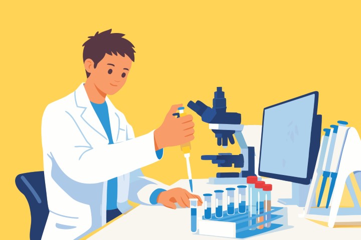 Male scientist working with a microscope and chemical samples in a laboratory.
