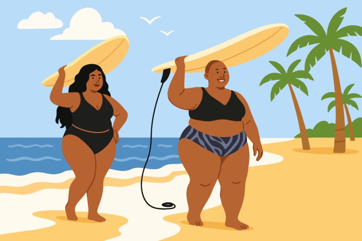 Celebrating Body Diversity. In Beachwear. In A Holiday Mood. Two Friends Walking On A Warm Beach.