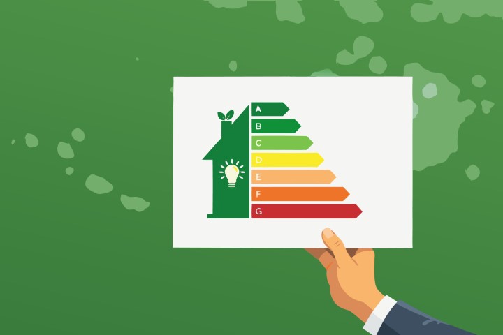 Efficiency certificate for a green home held against a natural backdrop.