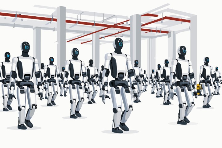 Group of humanoid robots stand in formation inside a large industrial facility.