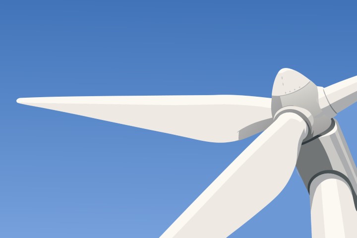 Large white wind turbine generating renewable energy under a clear sky.