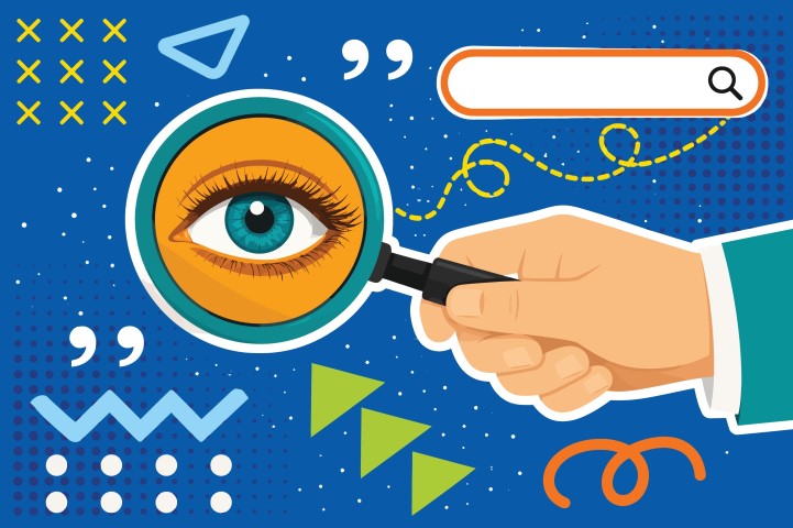Human hand using magnifying glass for search concept.
